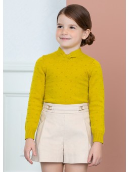 Col roulé en tricot noué...